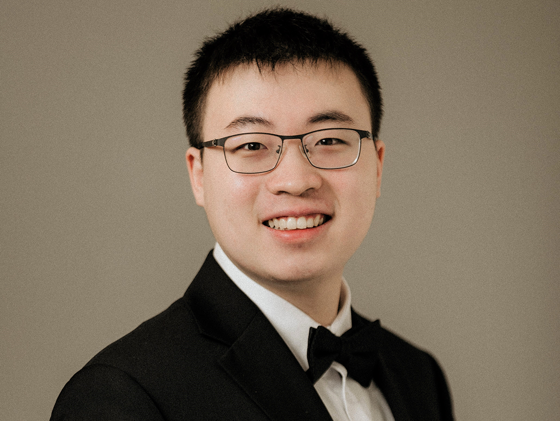 Asian-Canadian male pianist with glasses Hamiltot Lau